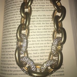 Gold and pave diamond blinded necklace.