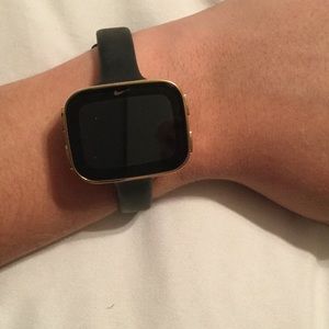 Gold Nike sports watch.
