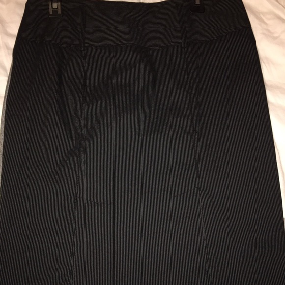 Striped black pencil skirt, knee length.