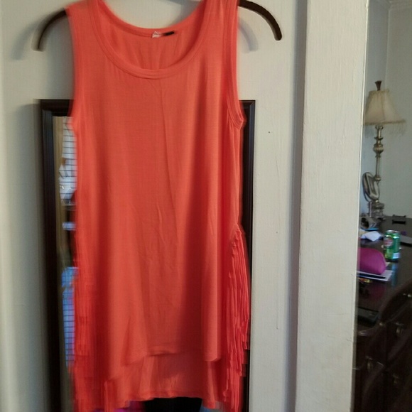 womans coral colored fringe tank tip
