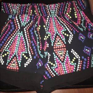 Black base, with color pixel like stretchy shorts