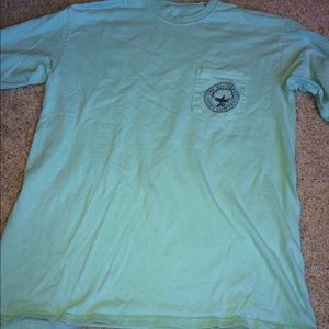 Teal southern company shirt.