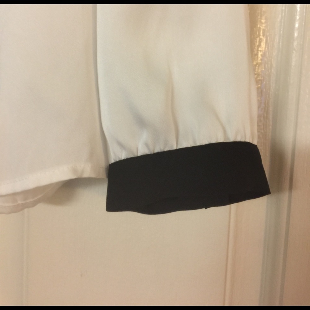 White blouse with black shoulders and cuffs. - Picture 3 of 5