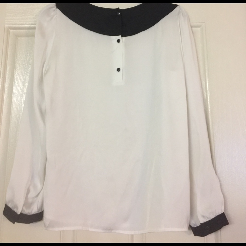 White blouse with black shoulders and cuffs. - Picture 5 of 5