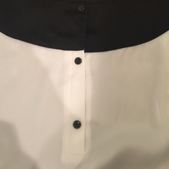 White blouse with black shoulders and cuffs. - Picture 2 of 5
