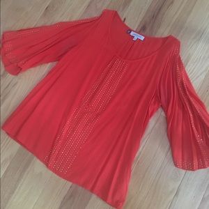 Jennifer Lopez orange and gold top