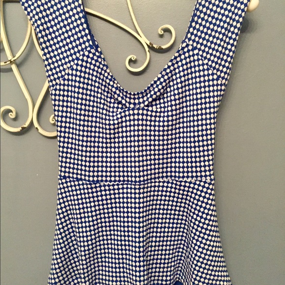 Deletta Cross-Back Cut out Peplum Top