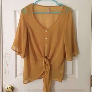 Sheer 70s-inspired yellow top