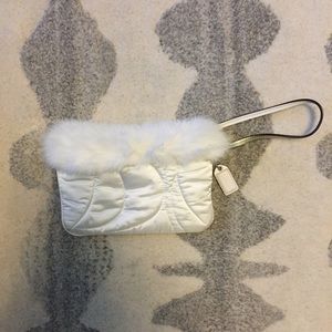 Like new Coach satin and fur wristlet
