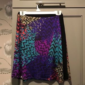 Multi color skirt with black tuxedo stripes.