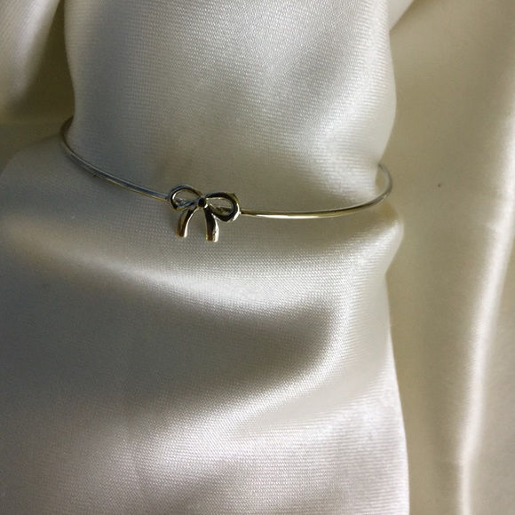 Silver toned ribbon bracelet