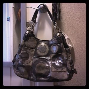 Grey coach purse.