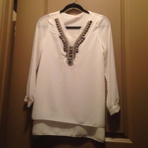 White tunics with gold beading