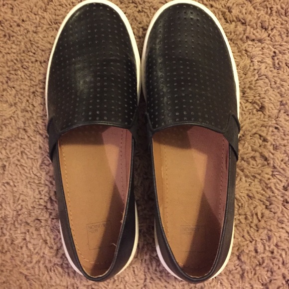 Black faux leather slip ons