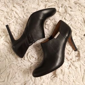 Black leather heels by Coach