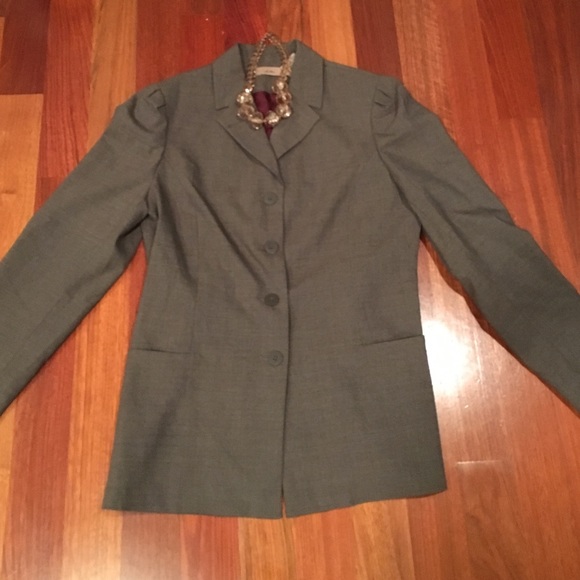 Brown jacket w/four buttons and two side pockets.