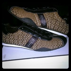 Coach shoes size 9.5 in women . Never worn