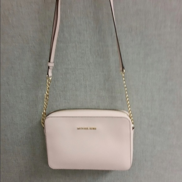 Authentic Michael Kors Blossom Jet set sling.
