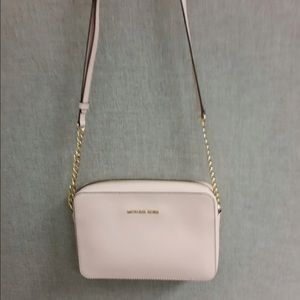 Authentic Michael Kors Blossom Jet set sling.