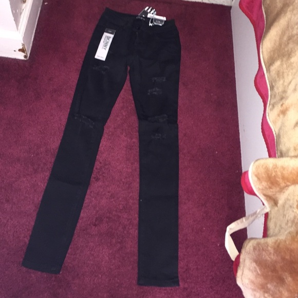 Destroyed denim black skinny jeans