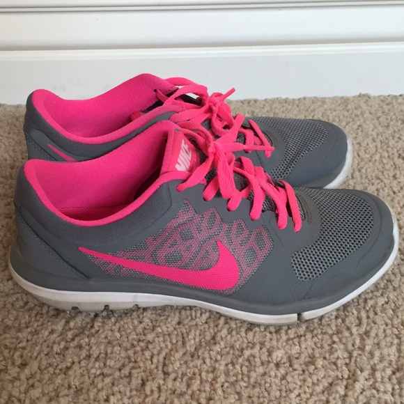 Pink and gray Nike running shoes