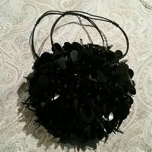 Small round black clutch