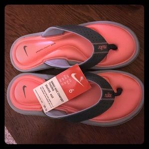 Coral and grey Nike comfort footbed flip flops
