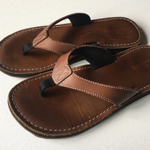 brown leather flip flops
