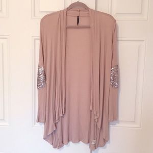 soft blush cardigan with sequenced elbows