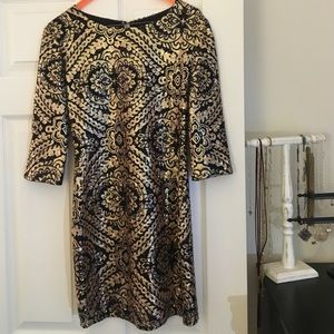 Black and gold sequined dress
