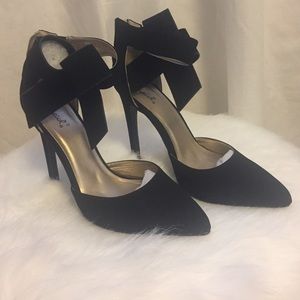 Black suede heels with bow