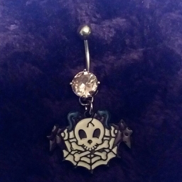 Skull and cross bones on spider Web belly ring