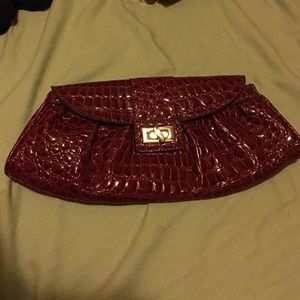 Red faux crocodile skin clutch