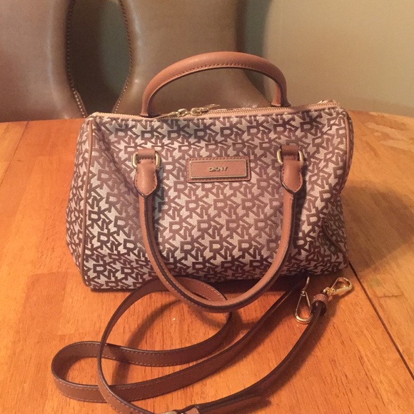 Never used DKNY handbags; genuine leather accents