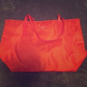 Orange Tumi tote bag
