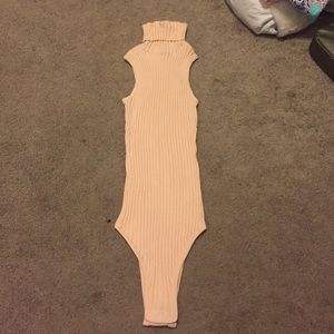 Pink turtleneck bodysuit