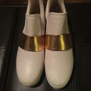 White and gold platform sneakers