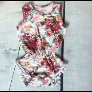 Girl's Floral Romper With Accented Pom Poms