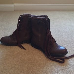Brown combat boots with knitted material on top