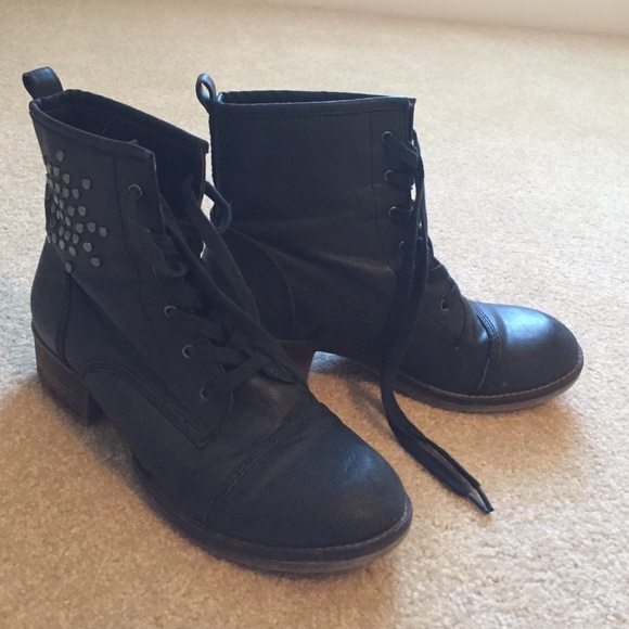 Black combat boots with silver design on side