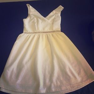 White evening dress with pearls.