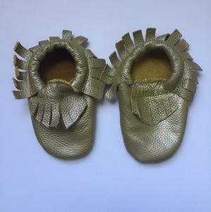 Gold moccasin shoes