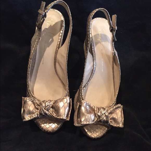 Franco Sarto mites gold animal print wedges.