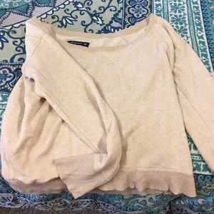 Cream colored off the should sweater