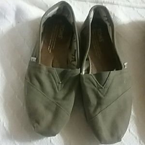 A pair of green Tom's