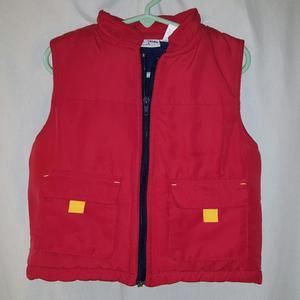 Really cute red vest trimmed in navy blue fleece