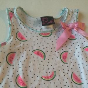 2 tops Girls Rule brand. Used a hand full of times. One of the tops has a very small stain as on last pic.