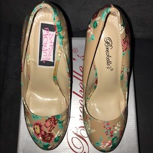 Brand new Heels tan with color flowers on it