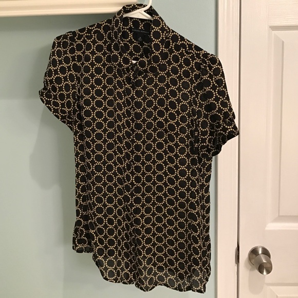 Black and gold blouse.