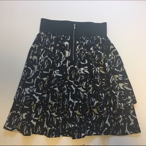 Black floral knee length skirt with exposed zipper
